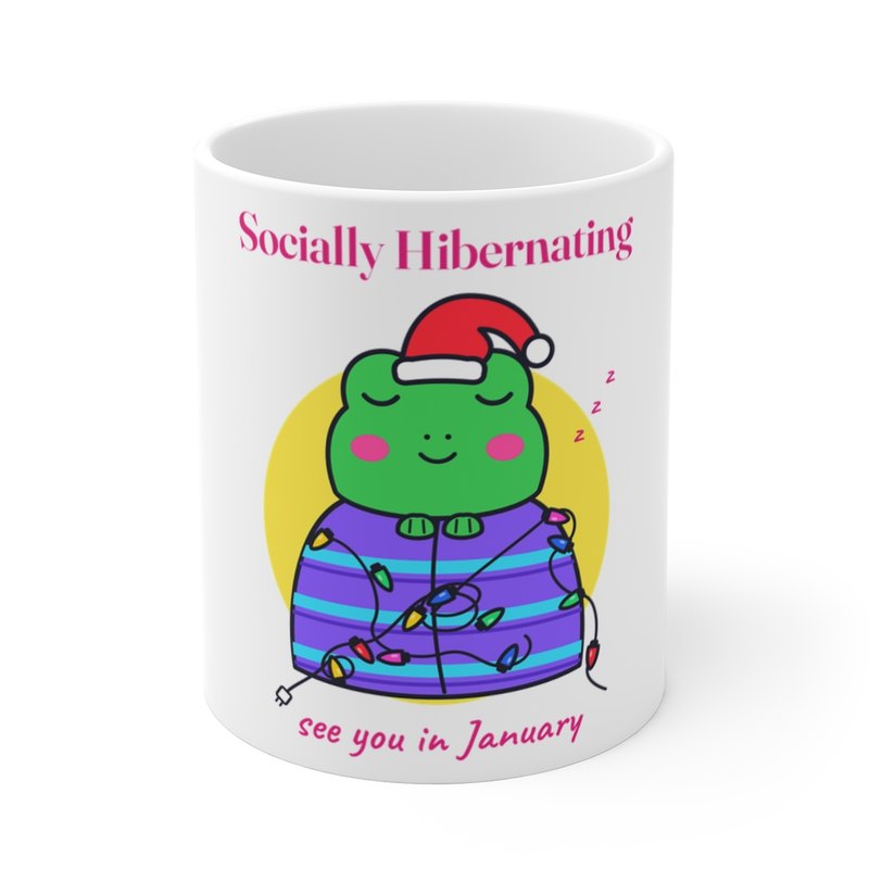 White mug printed with the Socially Hibernating Christmas frog in bright