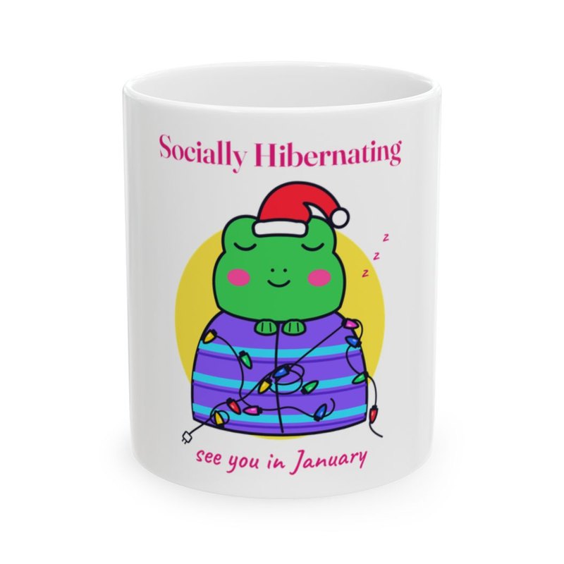 White mug printed with the Socially Hibernating Christmas frog in bright